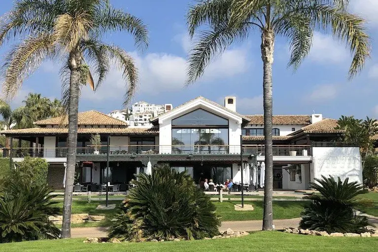 The clubhouse at Los Arqueros Golf Course. Los Arqueros luxury real estate for sale