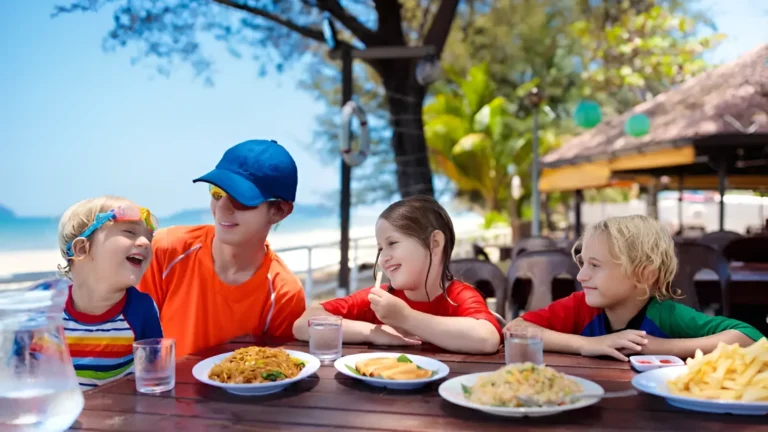 Family in Spain eating lunch on the beach. Raising a family in Spain